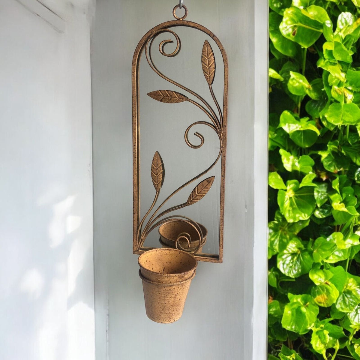 cortex-london-windsor-arched-metal-garden-wall-mirror-with-planter-rusty-patina