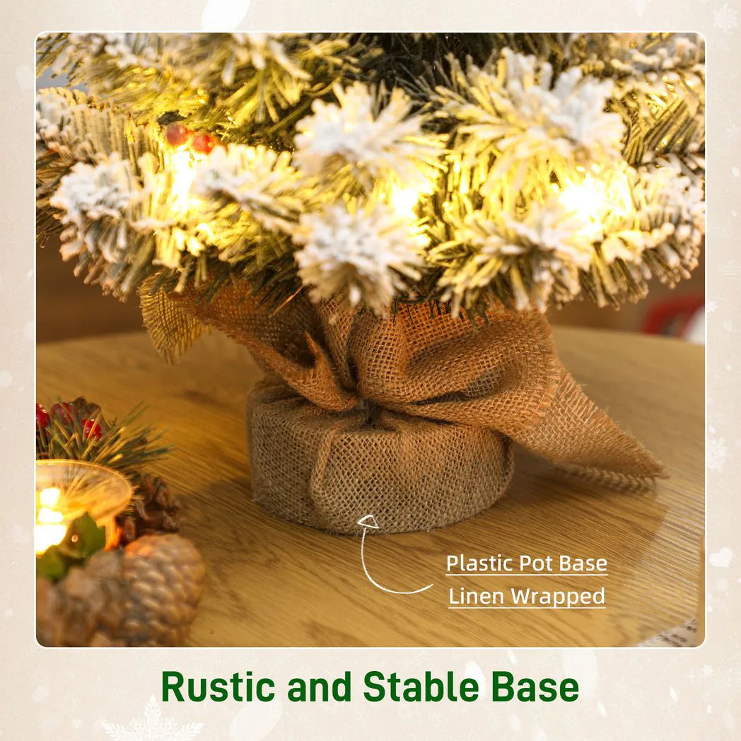 HOMCOM 60 cm Prelit Small Christmas Tree with 35 LED Lights, Snow Flocked Tabletop Mini Xmas Tree with 72 Dense Branches, Pine Cones, Berry Clusters and Linen Cover Base, Battery Operated, Green