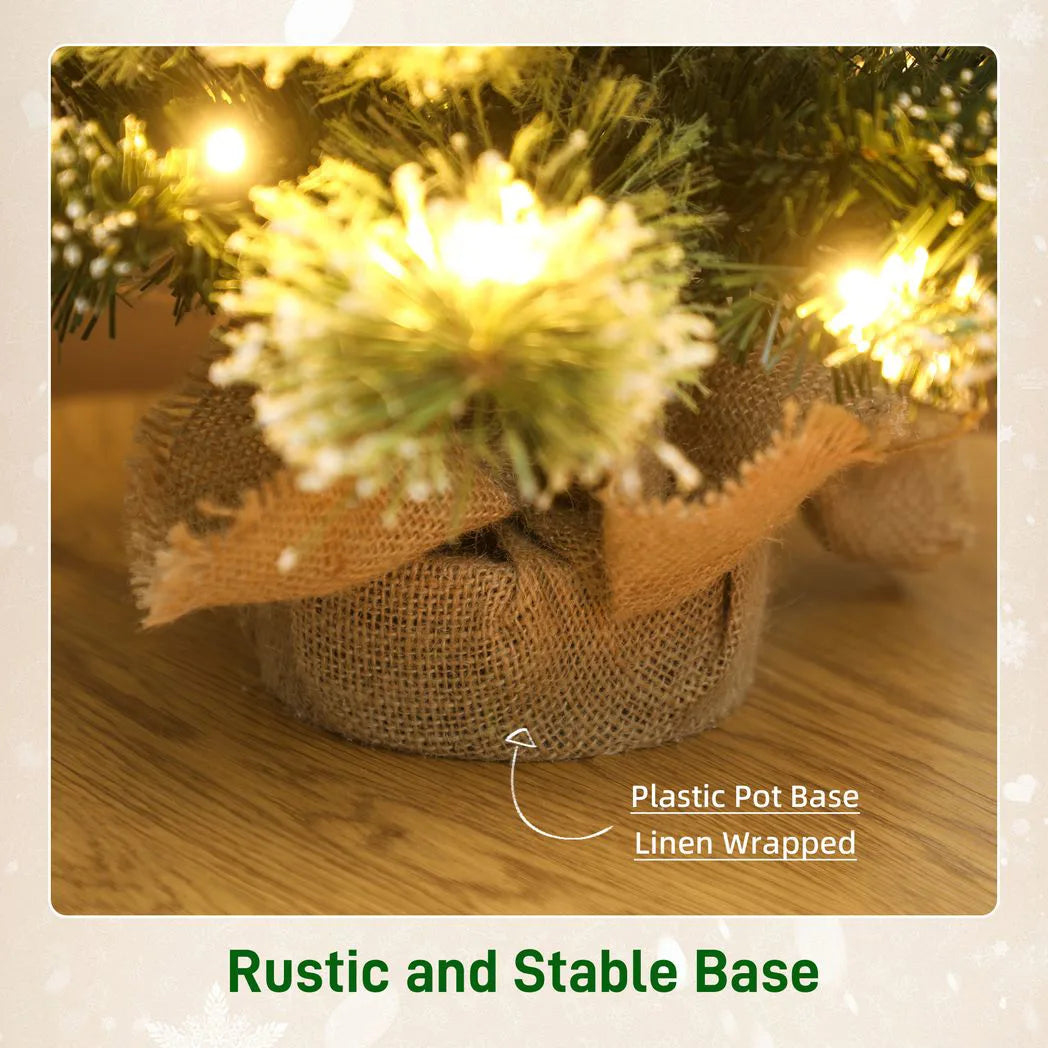 HOMCOM 60 cm Prelit Small Christmas Tree, Snow Flocked Tabletop Mini Xmas Tree with 35 LED Lights, Pine Cones and Linen Cover Base, Battery Operated, Green